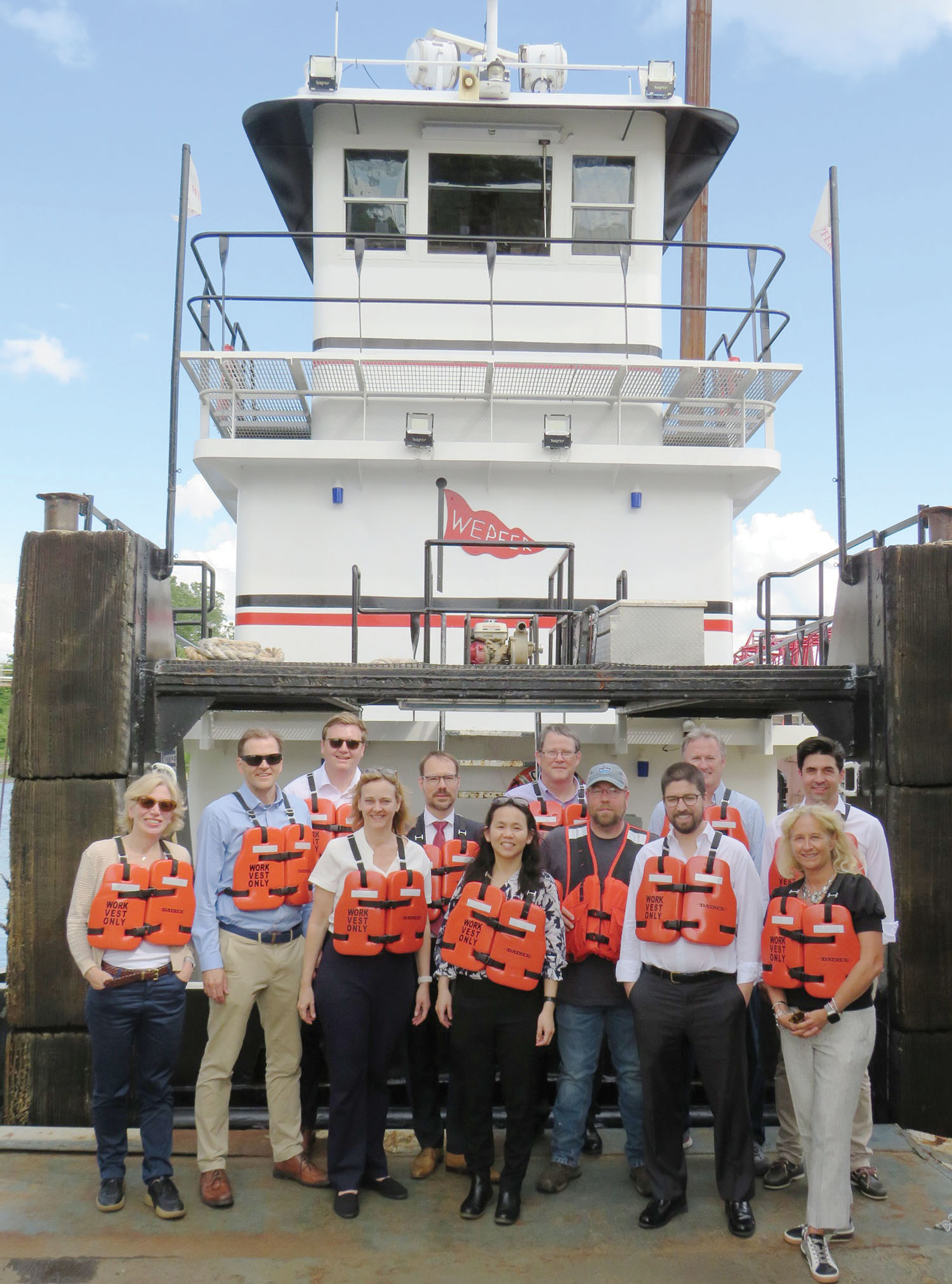 Embassy transportation and logistics counselors pose in front of the mv. Chris Foster during a tour of transportation facilities in Memphis May 14. (Photo courtesy of Ken Eriksen)