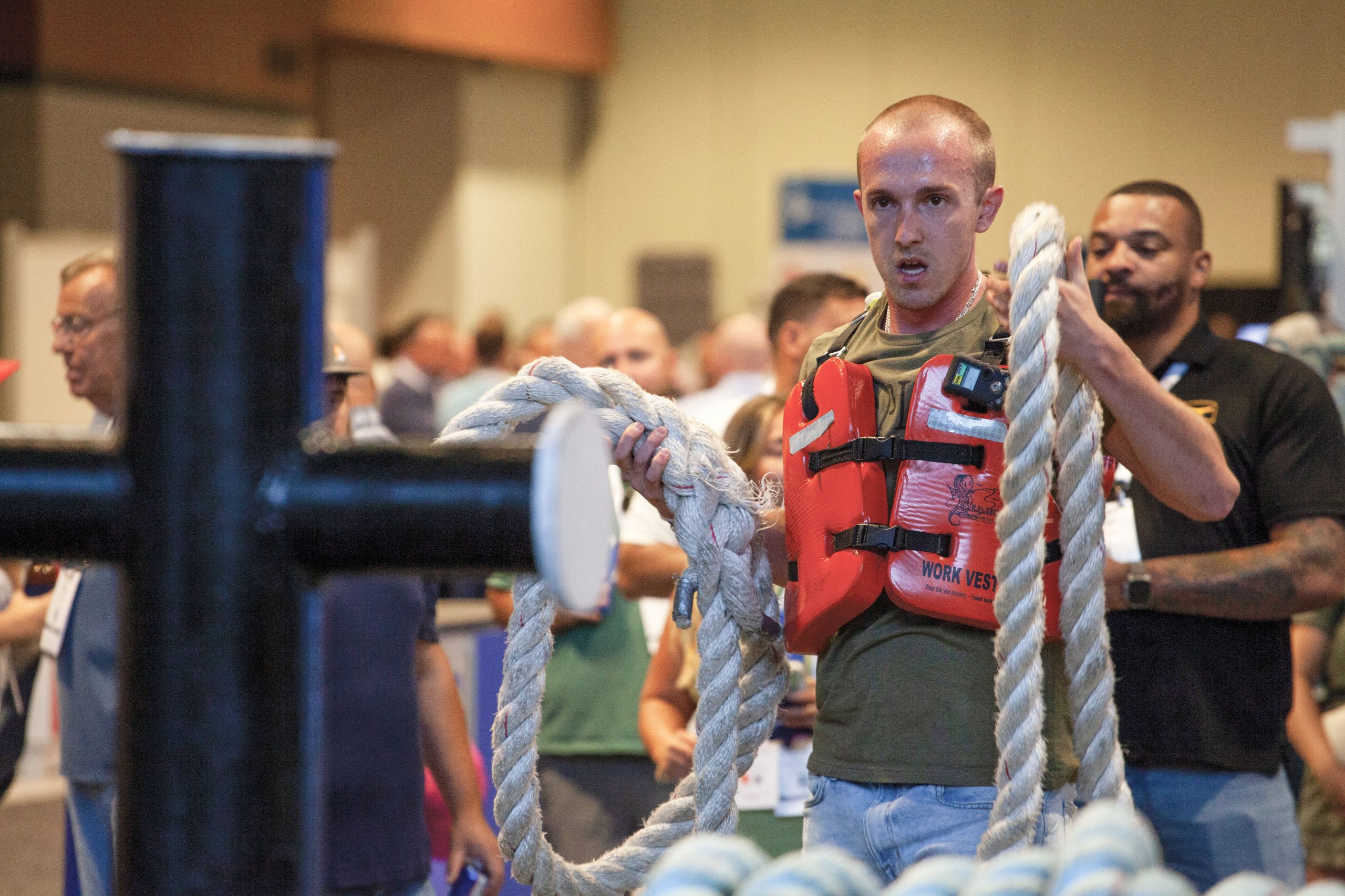 Leighton Loveless, a steersman with Central Boat Rentals, prepares to throw a line at the Maritime Throwdown final at IMX. Loveless came in first place. (Photosby Frank McCormack)