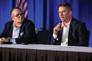 Tony Odak (left), chief operating officer of John W. Stone, and Mike Complita, principal and vice president of strategic expansion at Elliott Bay Design Group, discuss the ins and outs of decarbonization for marine operators. (Photo courtesy of Event Coverage Nashville)