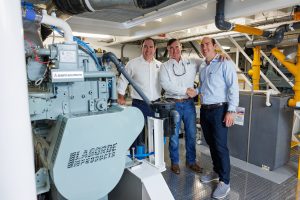 From left to right, Brian Laborde, president and CEO of Laborde Products, Kirby Corp. President and Chief Operating Officer Christian O’Neil, and Trace Laborde, vice president of business development for Labord, stand together in the engine room of the mv. Bob Livingston. (Photo courtesy of Laborde Products)