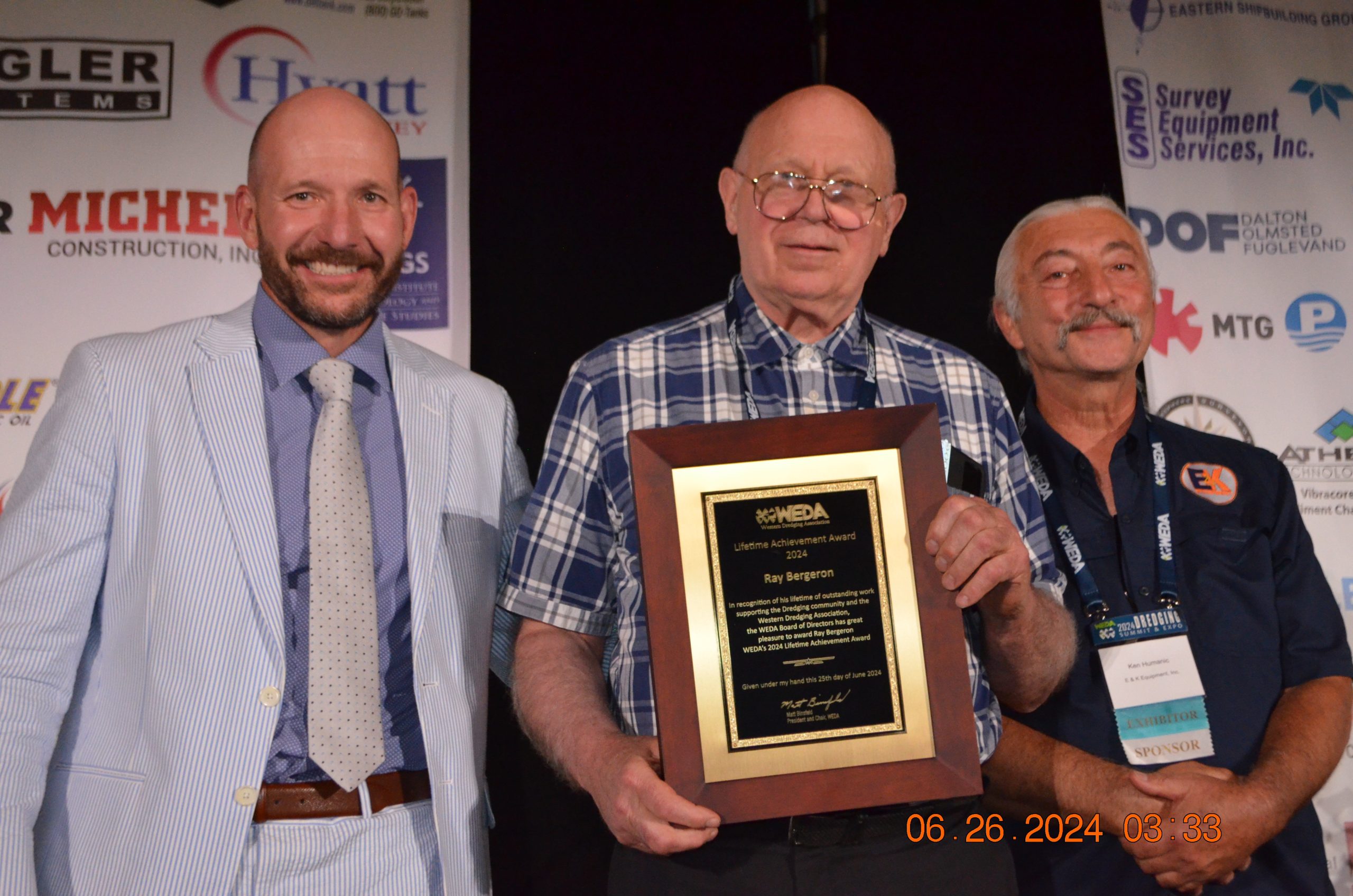 Ray Bergeron, center, receives the WEDA 2024 Lifetime Achievement Award during the association’s 2024 Dredging Summit and Expo. With him are Matt Binsfeld (left), president of WEDA, and Ken Humanic, who presented the award. (Photo by Judith Powers)