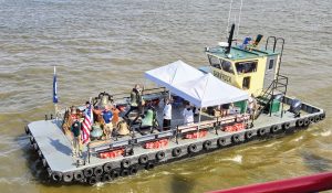 The mv. Chloe Armentor, a Shamrock Marine crew boat, carries bells as part of the Fête-Dieu du Mississippi. (Photo by Richard Eberhardt)