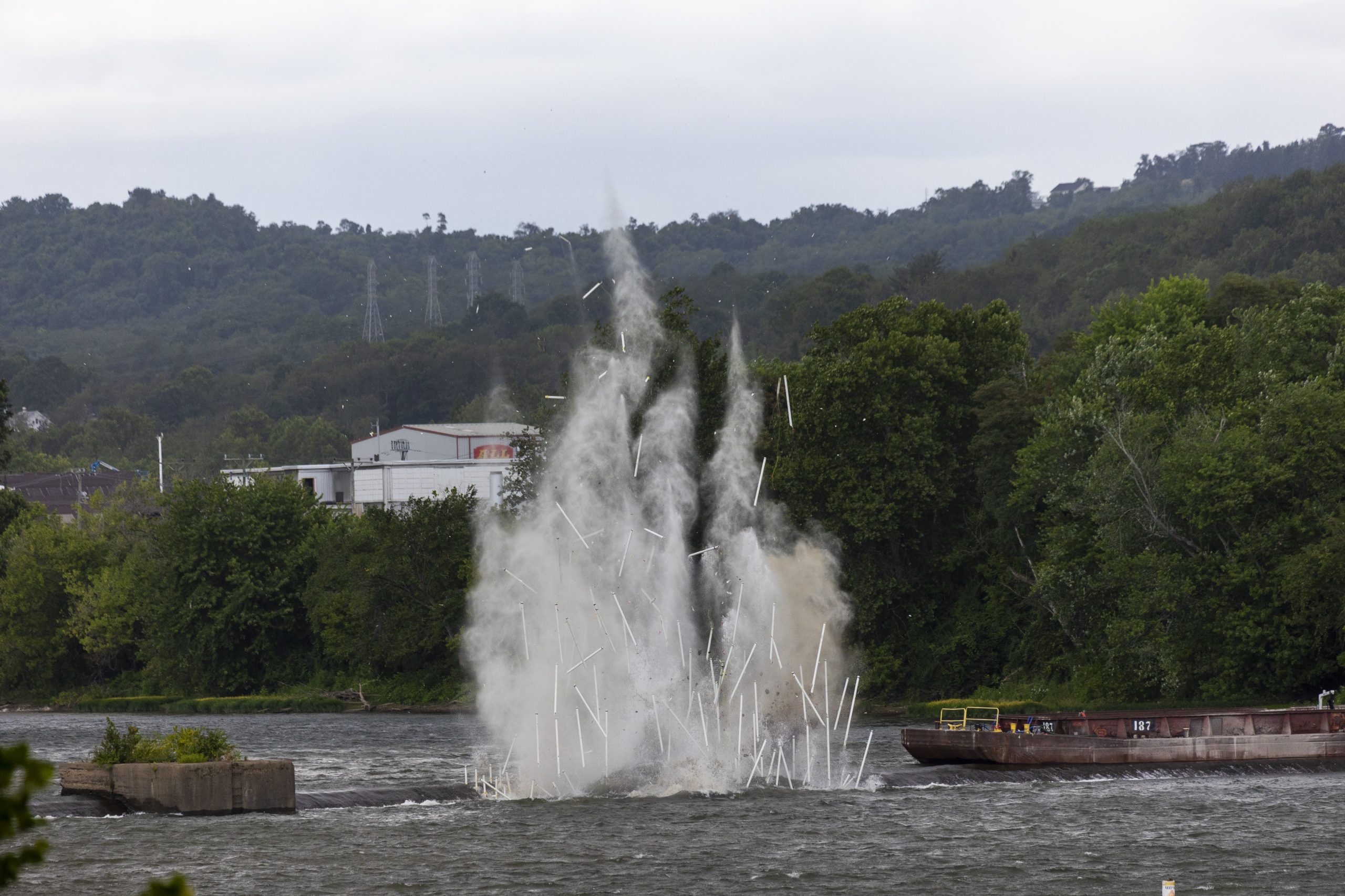 Debris flies into the air following the first controlled detonation of Monongahela Dam 3 near Elizabeth, Pa. (Photo by Michel Sauret/Pittsburgh Engineer District)