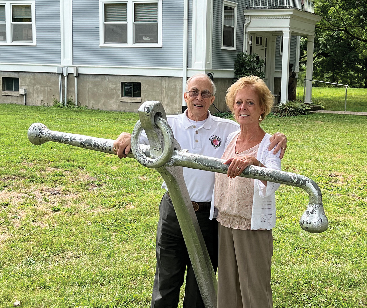 Capt. Bill Barr and Nancy Summers pose with the anchor displayed at Port Amherst in Charleston, W.Va., during their recent 50th employment anniversary celebration. (Photo courtesy of Amherst Madison)