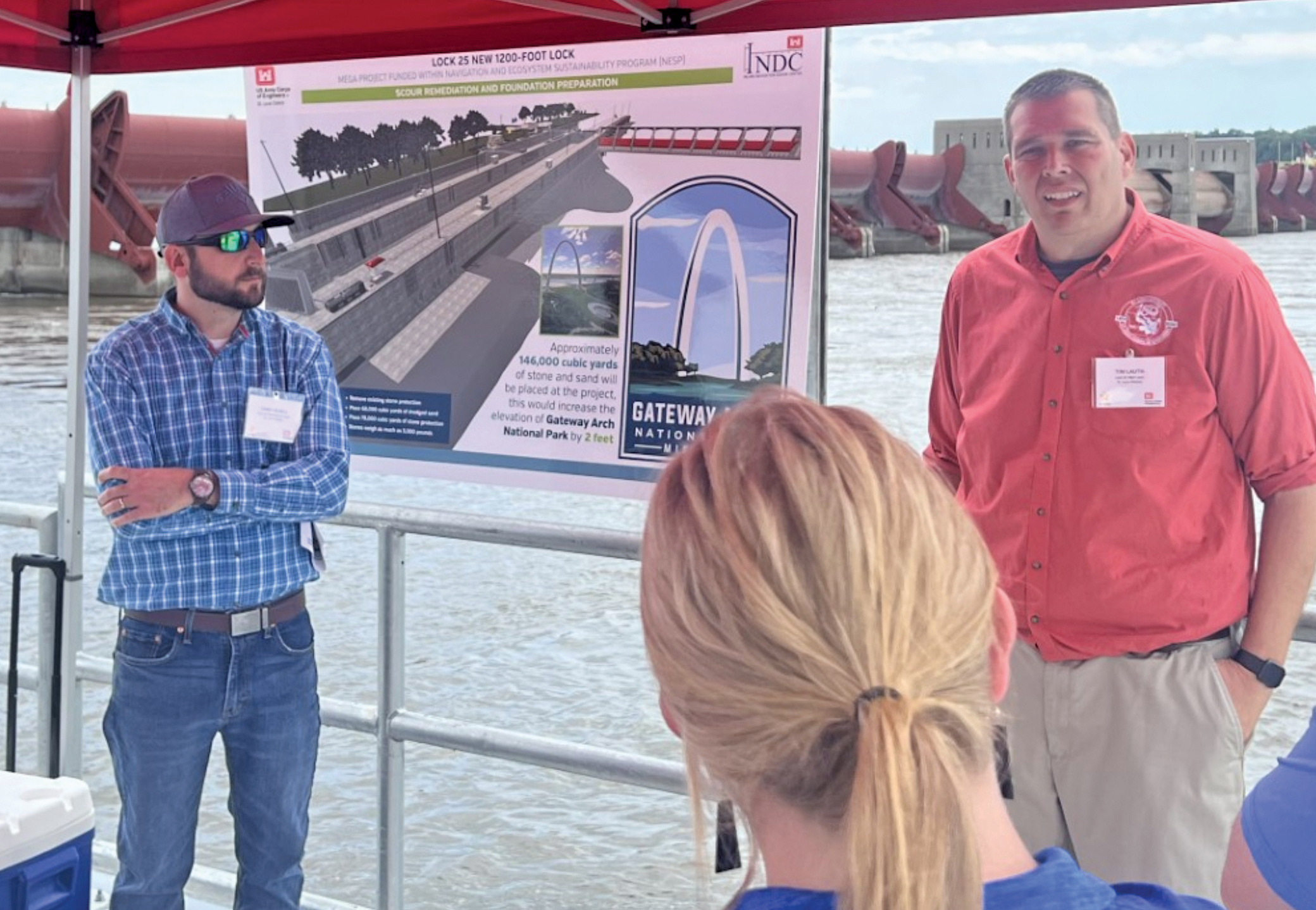 Chris Redell (left) and Tim Lauth discuss scour remediation and foundation prep during an Inland Waterways Users Board tour of Lock and Dam 25 near Winfield, Mo., July 31. (Photo courtesy of Waterways Council Inc.)