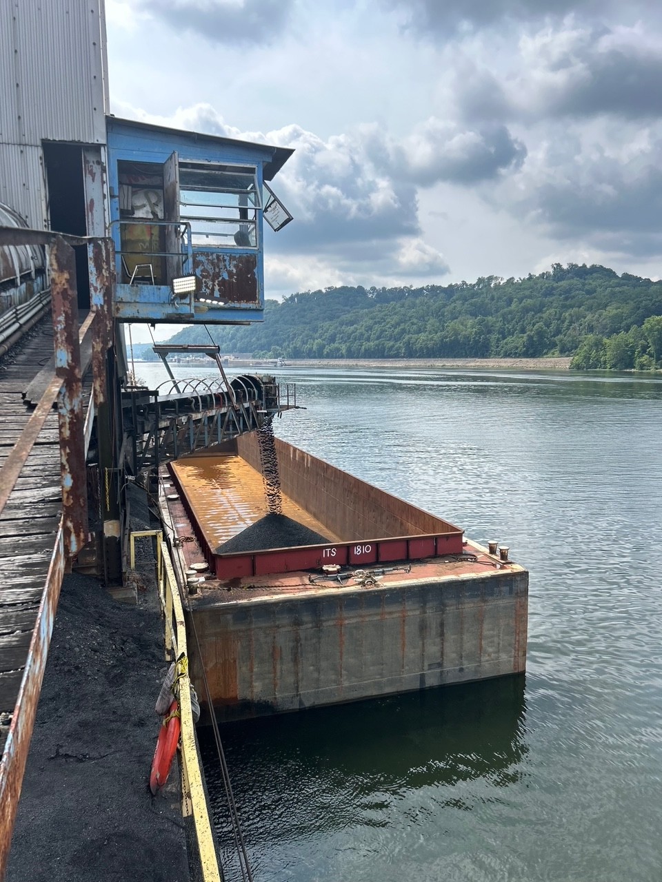 A barge is filled from a railcar at the ITS Leetsdale facility, Ohio River Mile 14, in Leetsdale, Pa. Industry Terminal & Salvage Company purchased the 30-year-old railyard, formerly Mol-Dok, in May. (Photo courtesy of Industry Terminal & Salvage Company)