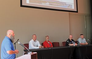 Josef Vlach, vice president for compliance and emergency management for James Marine, introduces members of the Shipyard Availability Panel. They are (left to right): Geoff Scibek of the Coast Guard’s Huntington Marine Safety Unit, Bill Foster of McGinnis, Barry Gipson of James Marine and Scott Meier of Wepfer Marine. Vlach moderated the panel.