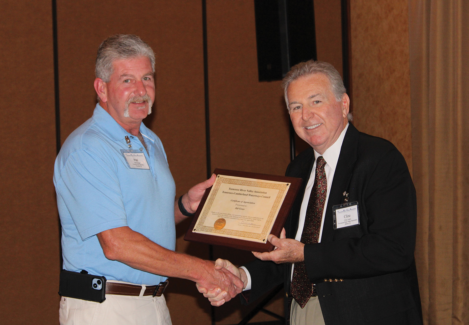 Tennessee River Valley Association executive director Cline Jones (right) presents a plaque to retiring board member and past president Hal Greer in appreciation for his years of service. (Photos by Shelley Byrne)