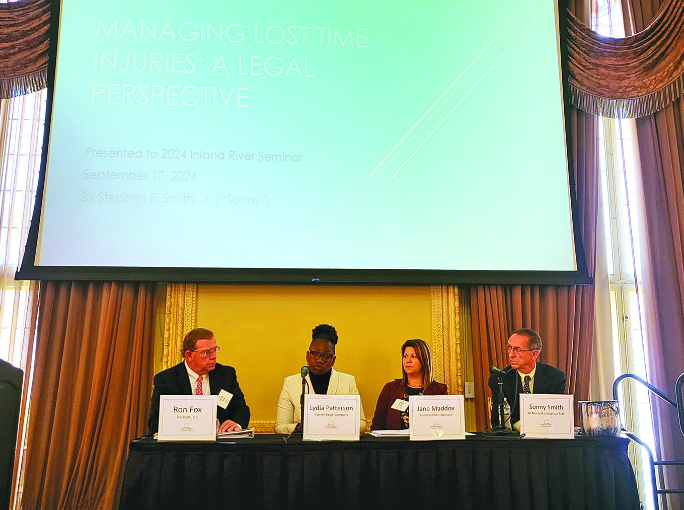 Attorney Ron Fox (left) and a panel of experts discuss how towing companies can manage lost time injuries. (Photos by Zac Metcalf)