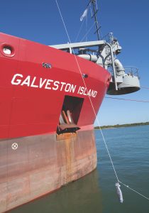 A bottle of champagne hangs, ready to christen the dredge Galveston Island October 25 in Galveston, Texas.